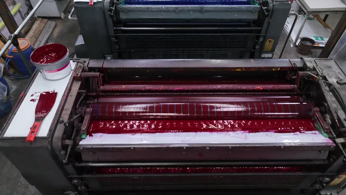 Coloured ink on the rollers of the printing press